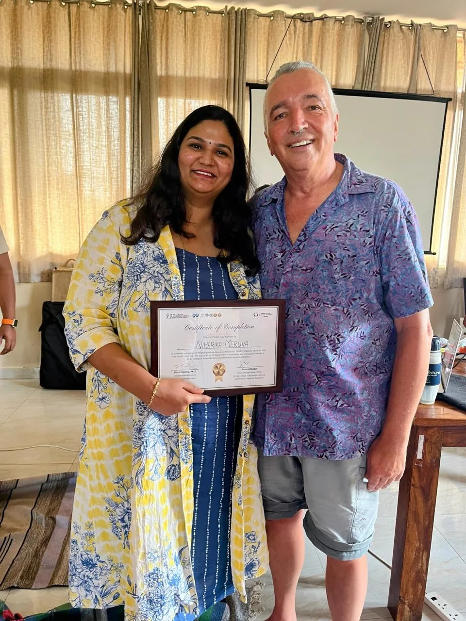 Niharika with her course teacher and certificate